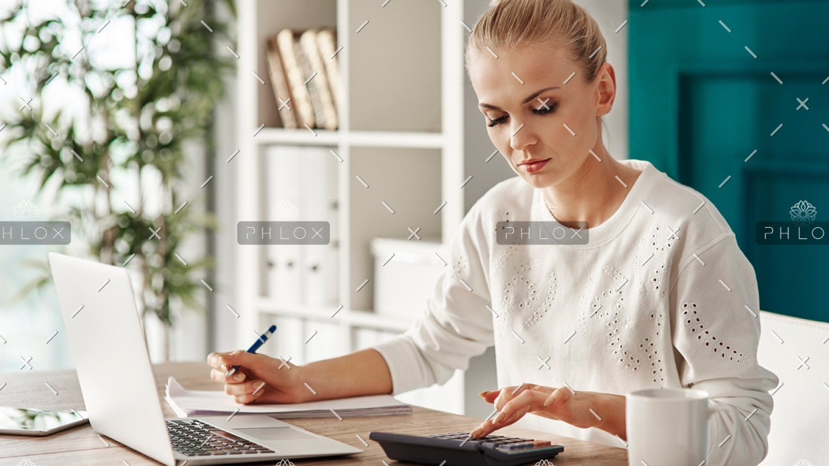 demo-attachment-469-concentrated-woman-budgeting-at-office-RVS7TEP